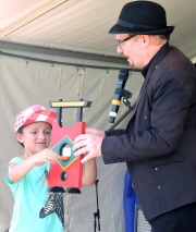 Magician David Lord Tries Out His Guillotine On A Young Volunteer-gallery