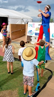 The Beach Party Stiltwalker Keeps The Kids Entertained By Spinning Plates-gallery
